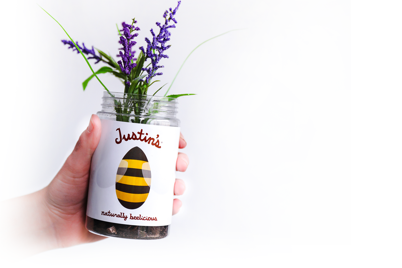 hand holding jar of flowers