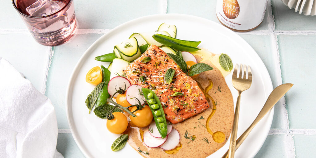 Baked Salmon with Spring Vegetables and Creamy Almond Butter Sauce