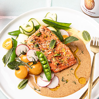 Baked Salmon with Spring Vegetables and Creamy Almond Butter Sauce